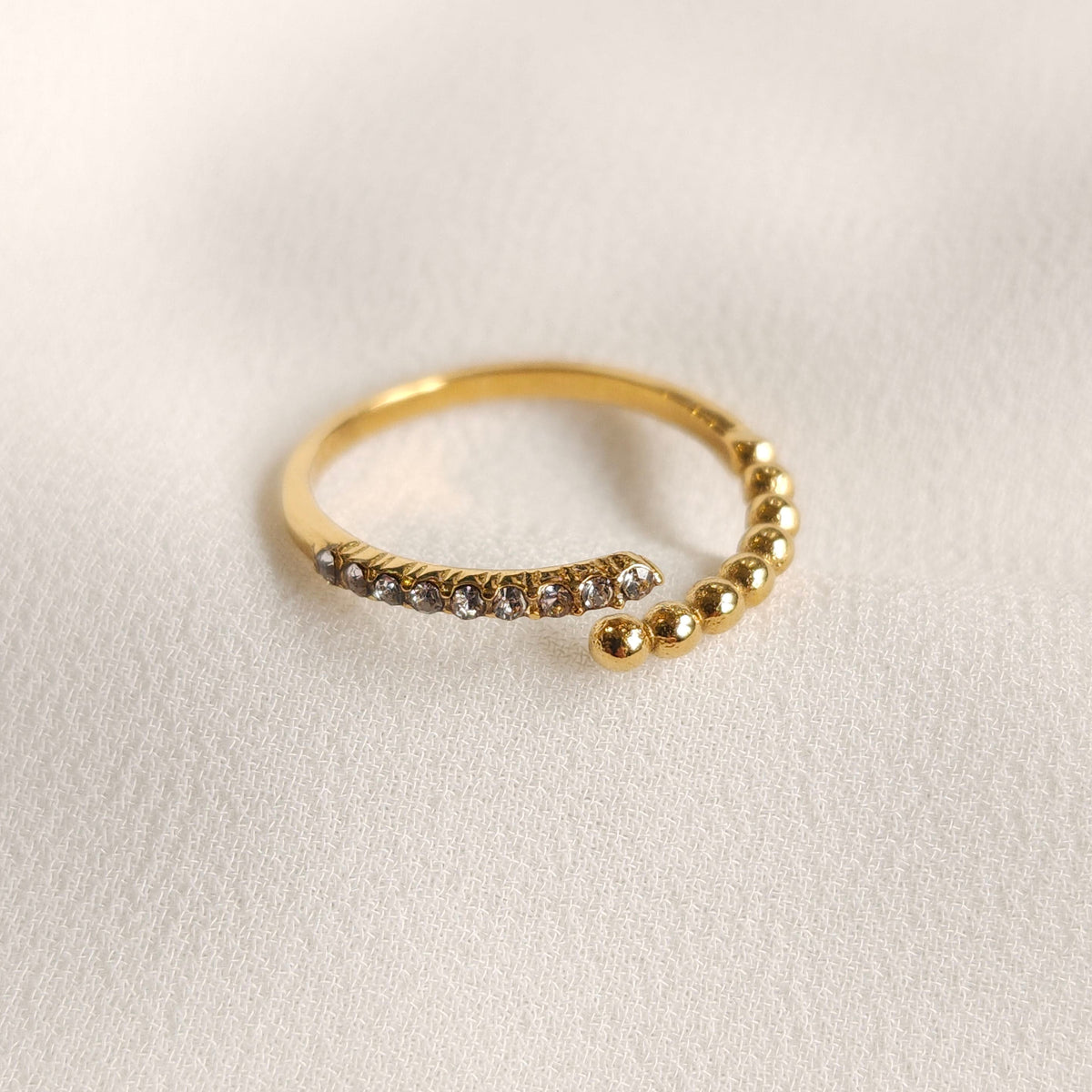 Close-up of the gold Beads and Sparkle Ring showing the gap between the beaded and clear-stone ends.