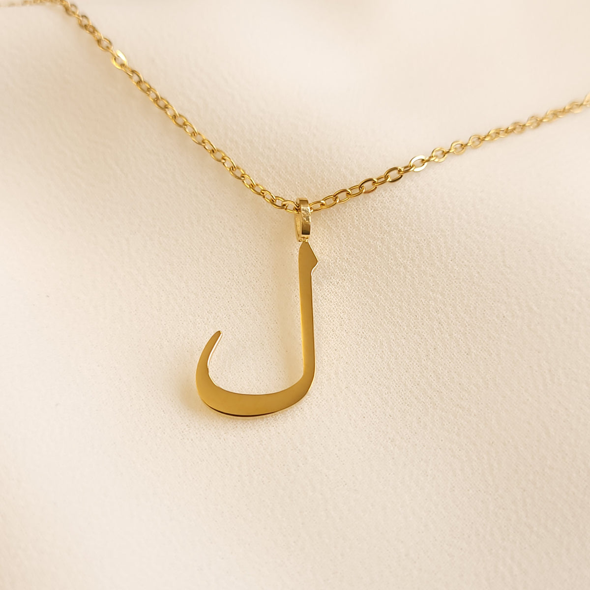 Gold-tone Arabic Initial Necklace with the letter Lam (ل) on a fine link chain.