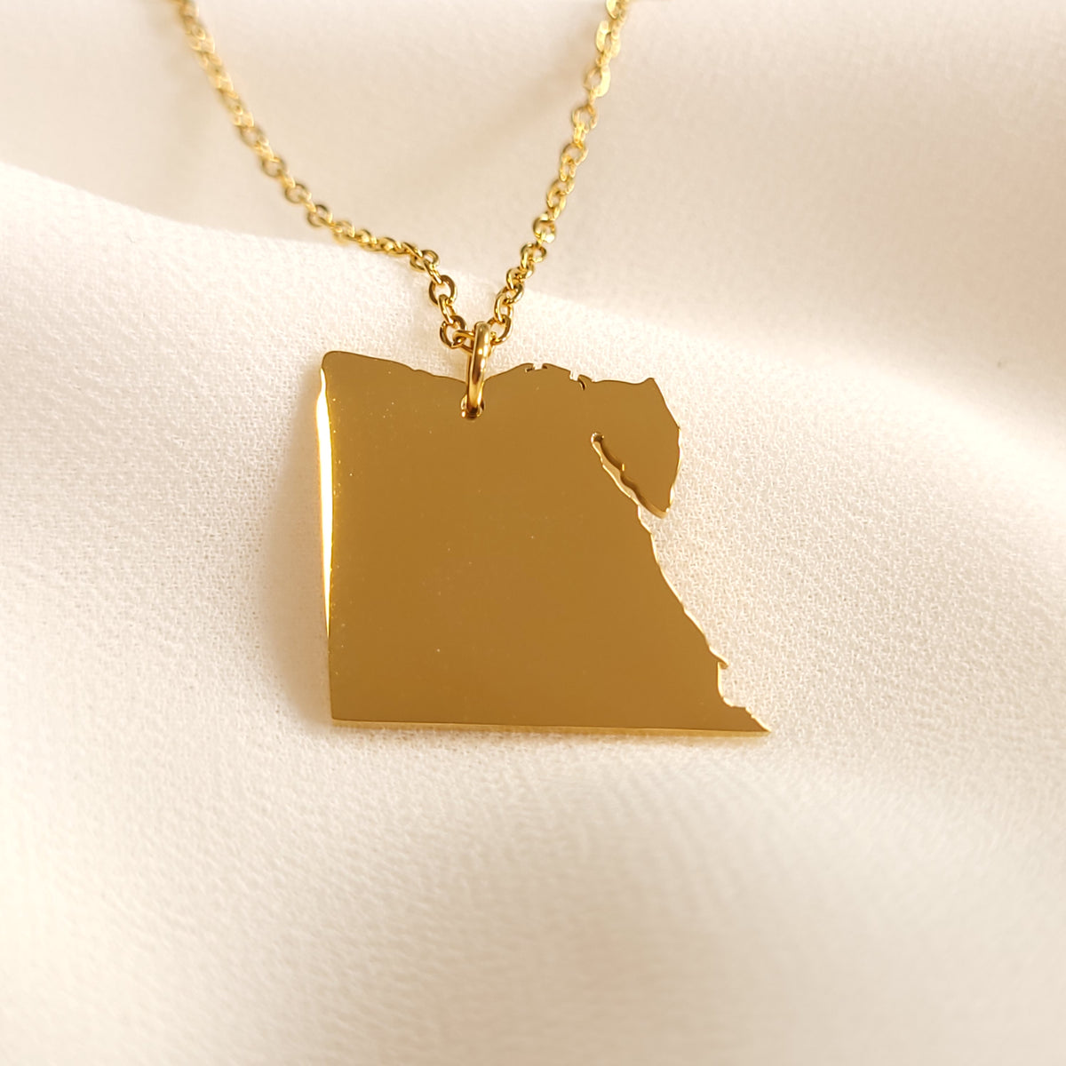Gold-tone Egypt map pendant necklace showing the country outline and Sinai Peninsula.