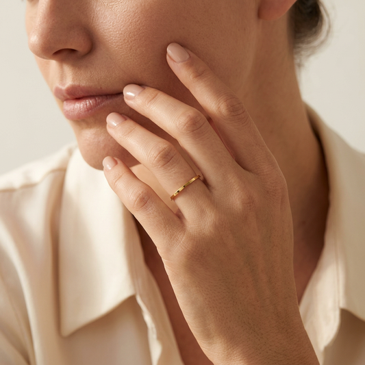 Model wearing the dainty gold stacking band ring