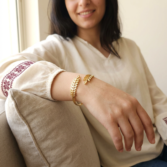 Palestinian woman wearing the gold Leaf Bangle