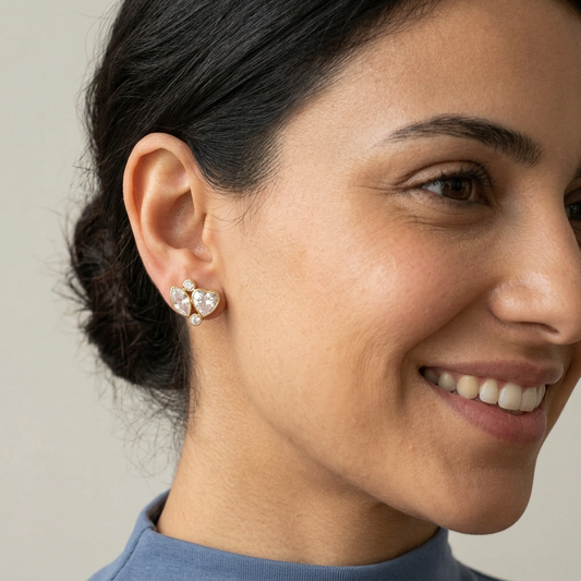 Smiling side-angle portrait wearing Sparkly Heart & Marquise Earrings