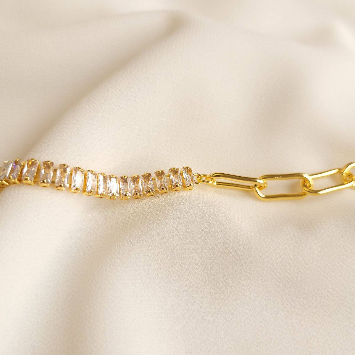Bold Link and Zirconia Bracelet close-up showing the clear rectangular stones joined to polished gold-tone links.