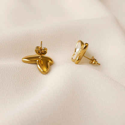 Back and side views of the Mother of Pearl butterfly earrings showing gold stud posts and butterfly backings.
