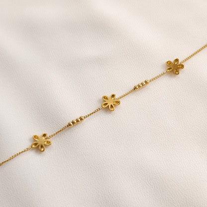 Back of the gold Daisy Chain Bracelet showing the hollow-backed flower petals and bead details