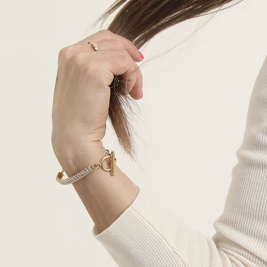 Bold Link and Zirconia Bracelet worn on a wrist, showing the clear stones and gold-tone toggle clasp.