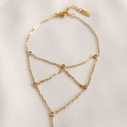 Close-up of the gold Mesh Hand Chain showing fine links and round clear stones at the chain junctions