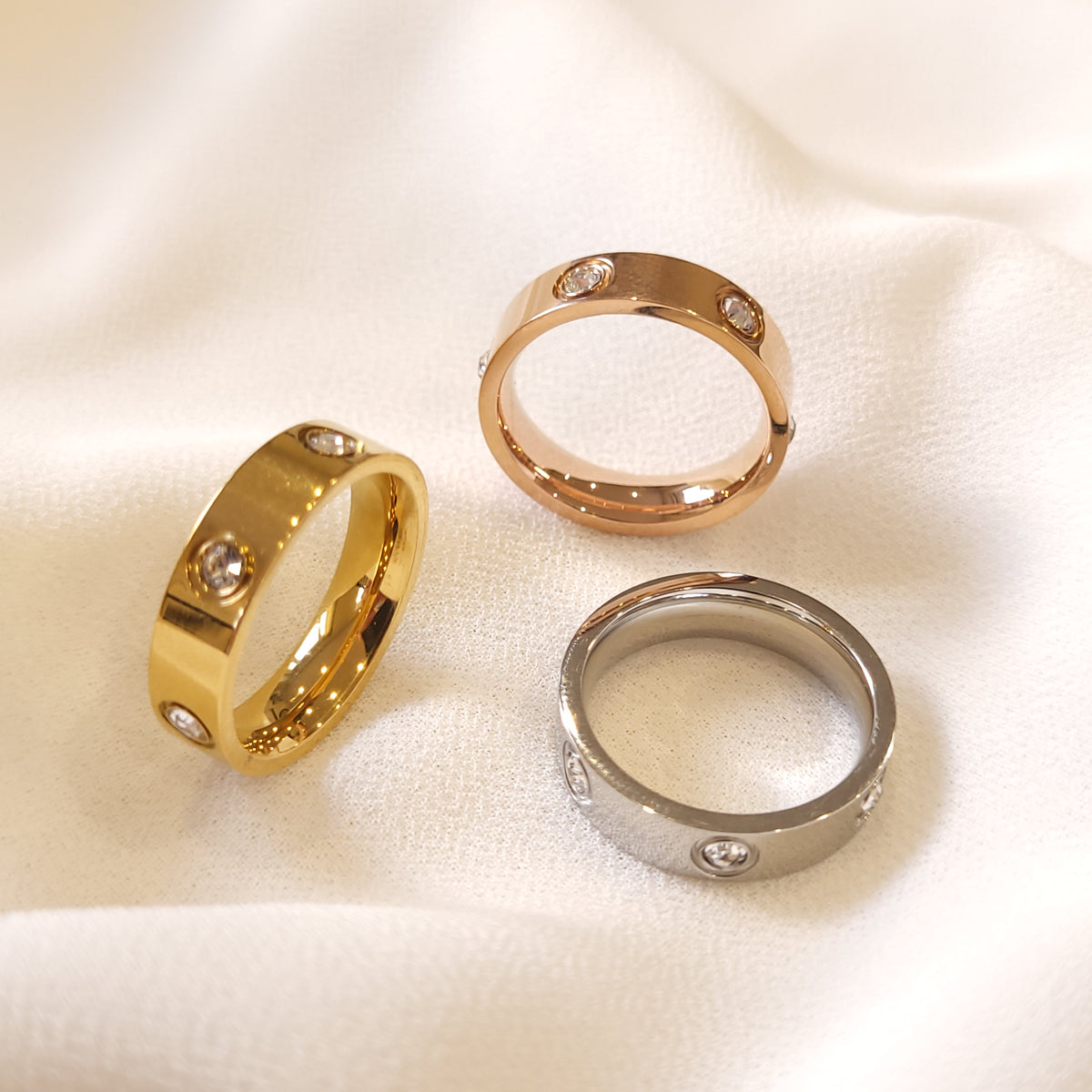 Crystal Stud Rings in gold-tone, rose gold-tone and silver-tone finishes with round clear stone accents.
