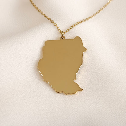 Front view of the gold-tone pre-split Sudan map pendant necklace.
