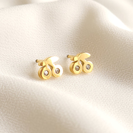 Gold-tone Cherry Stud Earrings with paired cherry shapes, leaf details and two clear stone accents on each earring.
