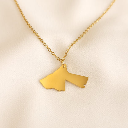 Gold-tone Jordan map pendant necklace with a polished silhouette.
