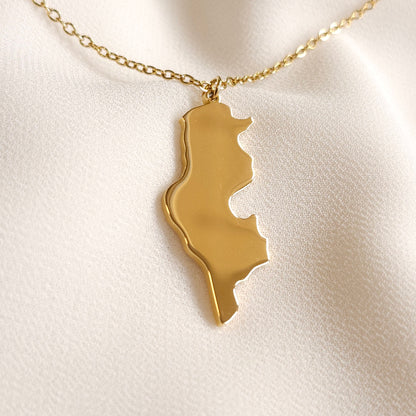 Gold-tone Tunisia map pendant necklace with a fine oval-link chain.
