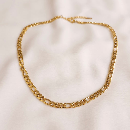 Gold Chunky Figaro Necklace with polished flattened links and an adjustable extension chain.
