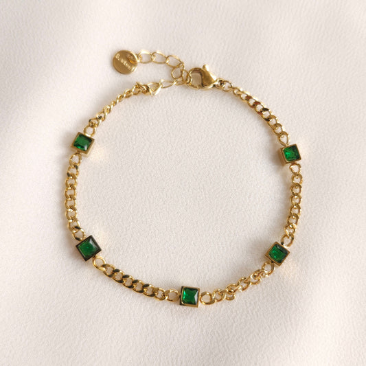 Gold Green Emerald Chain Bracelet with five square green stones spaced along a curb-link chain