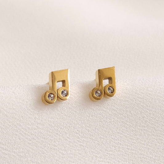 Gold Music Note Earrings with beamed-note shapes and clear round stones in the note heads.