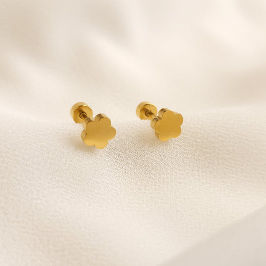 Little Clover Stud Earrings shown as a pair, featuring smooth gold-tone clover-shaped fronts and round flat backs.