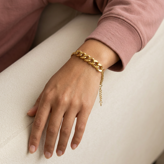 Mixed Cuban Bracelet worn on a wrist, showing the chunky gold-tone centre links and dangling extension chain.