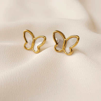 Mother of Pearl butterfly stud earrings with pearly white wings and polished gold borders.
