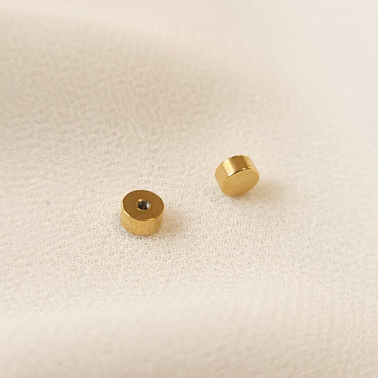 Pair of gold-tone Kids Screw-on Backings for Compatible Stud Earrings.