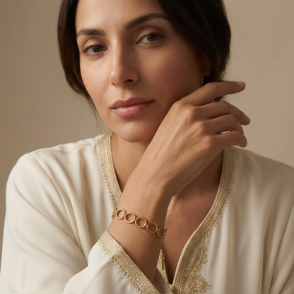 Close-up of the bracelet on a Middle Eastern model wearing an embroidered kaftan