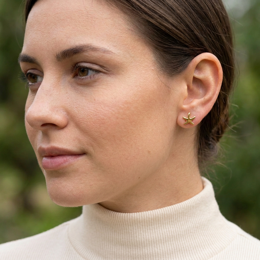 Close-up portrait with Starfish Earrings and a high-neck shirt