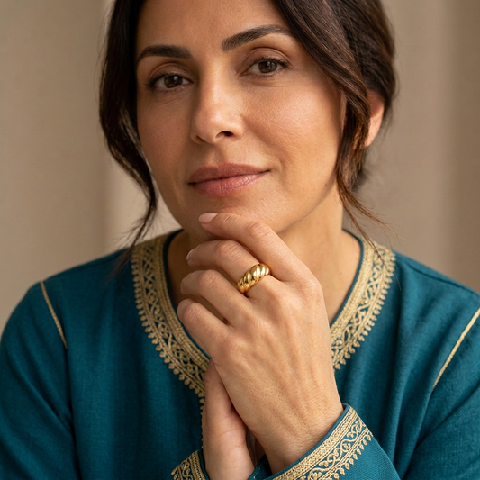 Model wearing a traditional-inspired teal kaftan and the Croissant Dome Ring