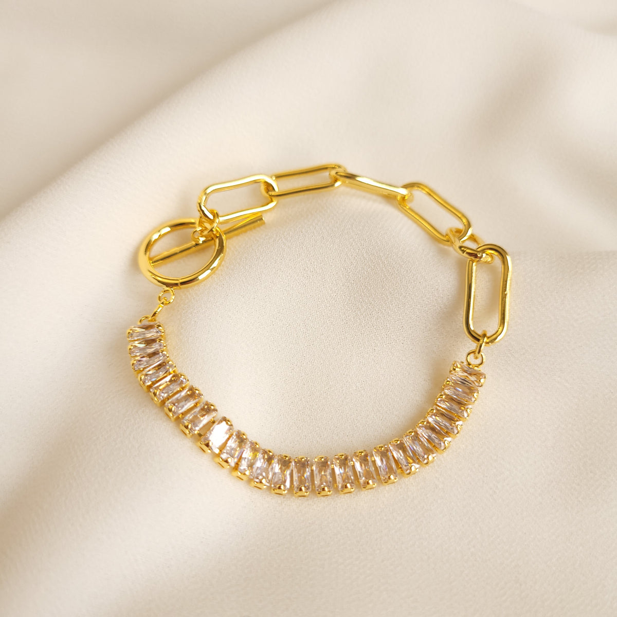 Bold Link and Zirconia Bracelet in gold tone, combining chunky rectangular links with a row of clear rectangular stones.