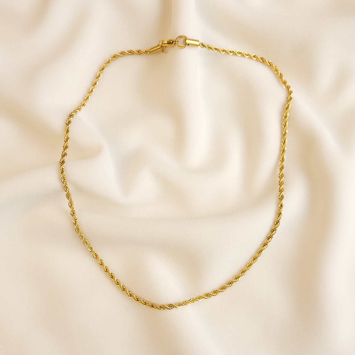 Essential Rope Necklace arranged in a loop, showing its full length and clasp at the top.