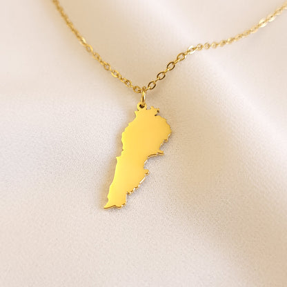 Gold-tone Lebanon map pendant necklace with a polished silhouette and fine chain.
