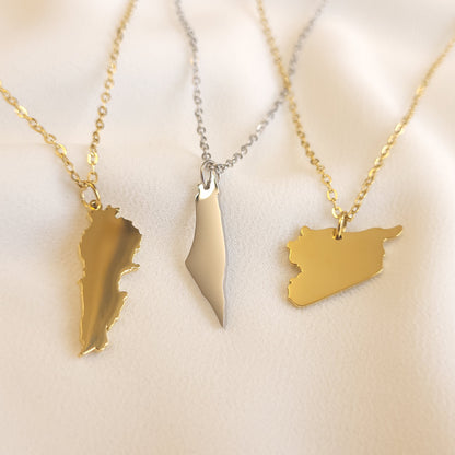 Lebanon, Palestine and Syria map pendant necklaces displayed together in gold-tone and silver-tone finishes.
