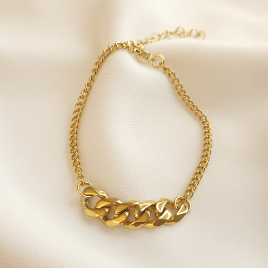 Mixed Cuban Bracelet arranged in a loop, featuring chunky gold-tone centre links joined to a finer curb chain.