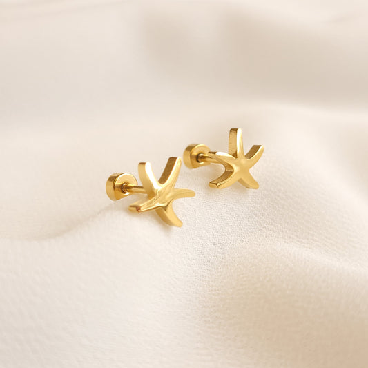 Pair of gold-tone Starfish Earrings with five curved arms, a polished finish and round backings.
