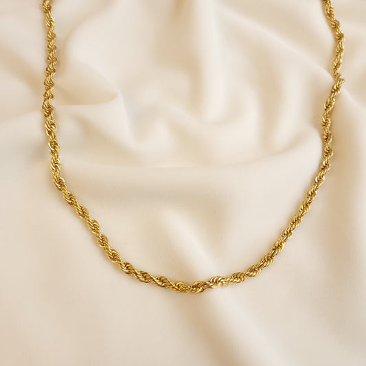 Thick Essential Rope Necklace in gold tone, showing its rounded profile and tightly intertwined links.